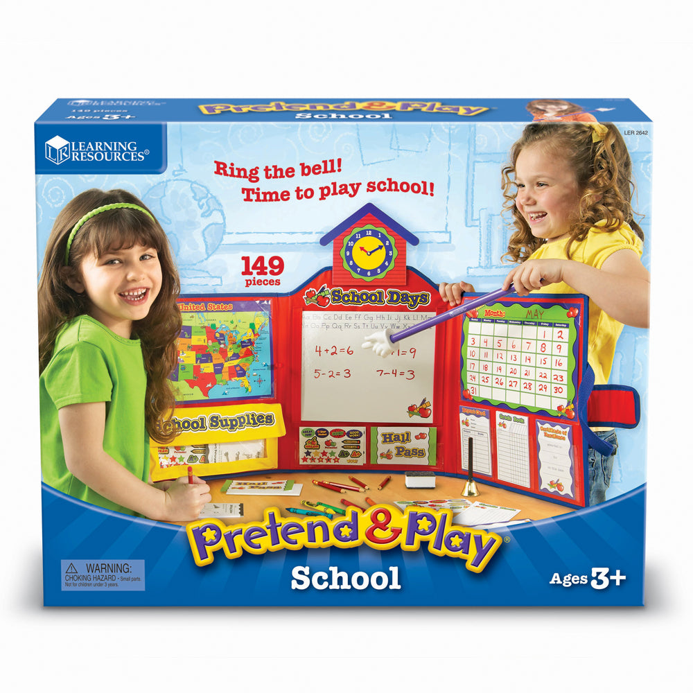 Pretend & Play School set modeled by two children, featuring red schoolhouse with clock, whiteboard with math equations, calendar, and 149 pieces including scho