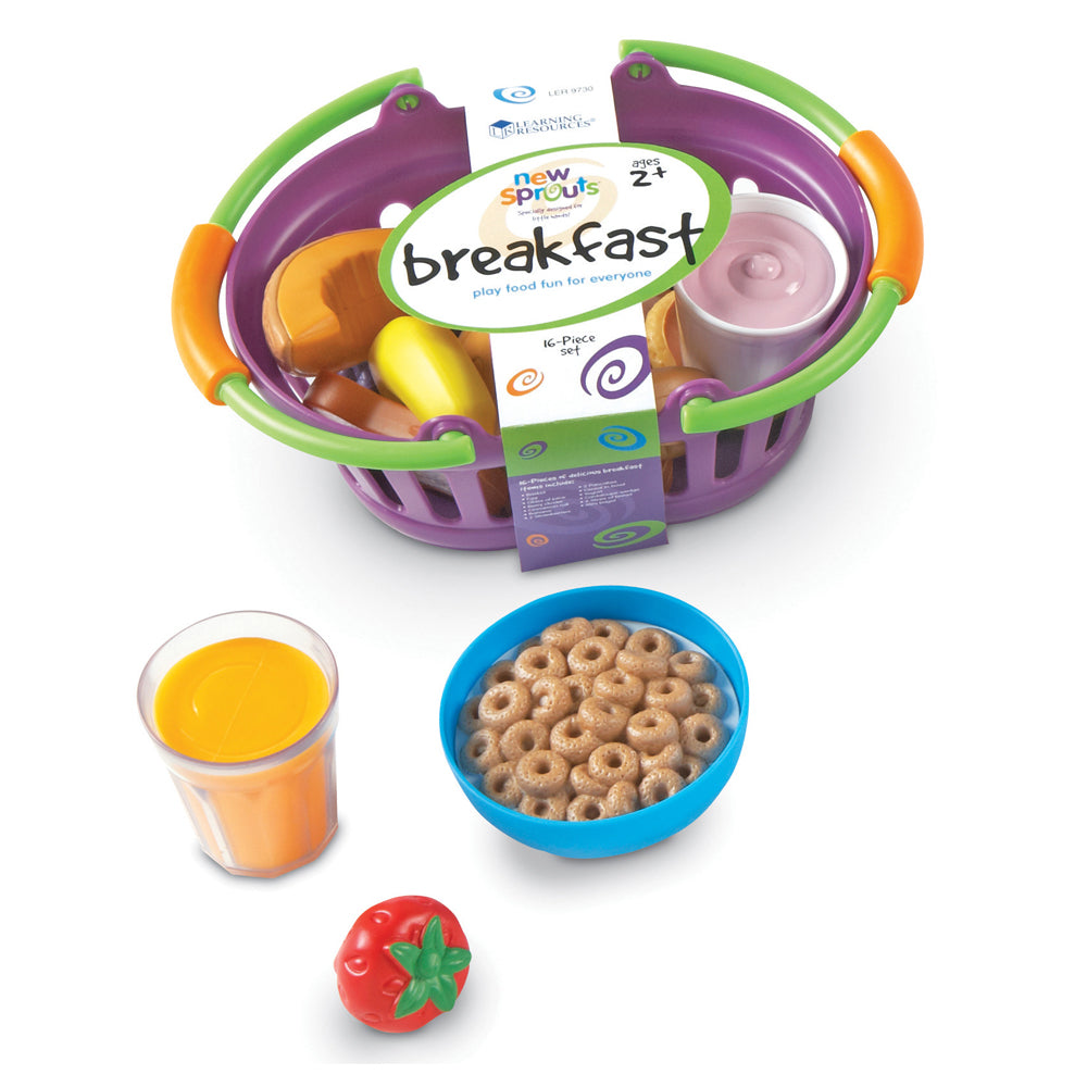New Sprouts Breakfast play food set with purple and green basket containing toy food items, orange juice cup, bowl of cereal, and red tomato