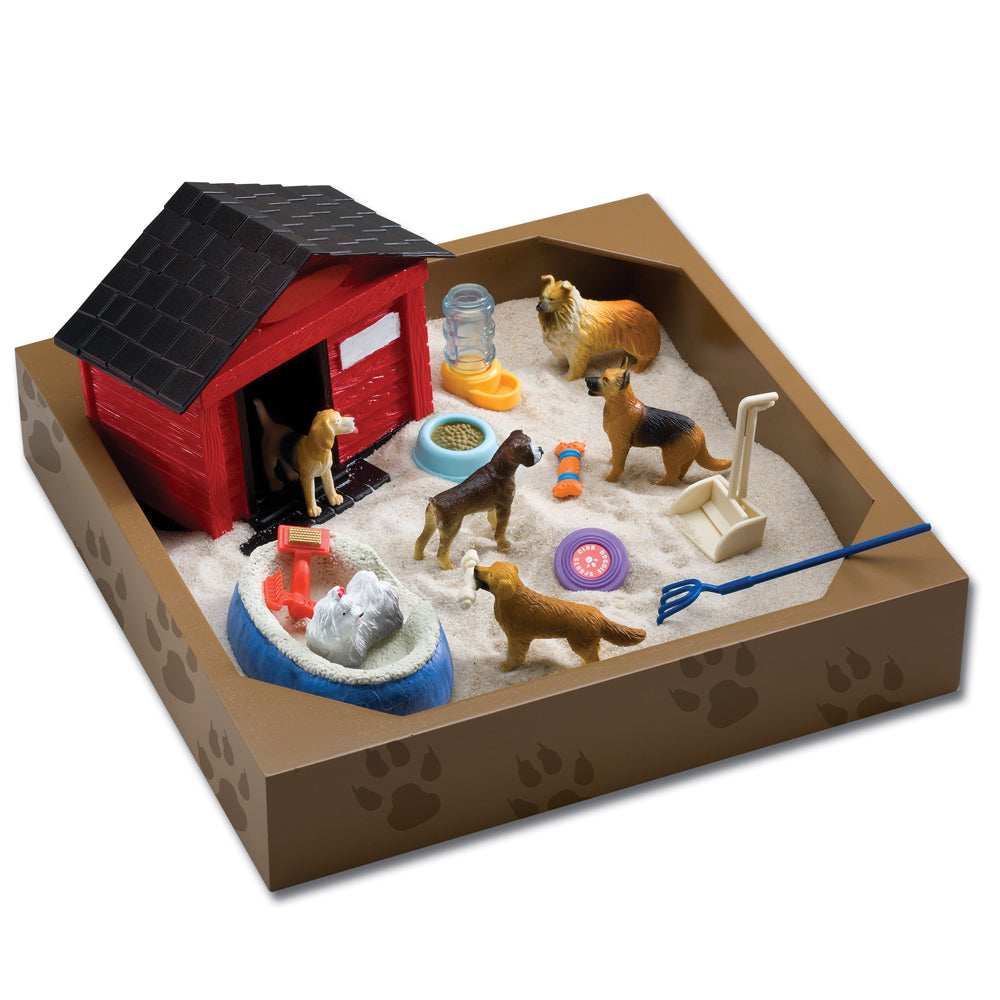 Doggie Day Camp Play Set sandbox with red dog house, multiple dog figurines, food and water bowls, toys, and accessories on sand base
