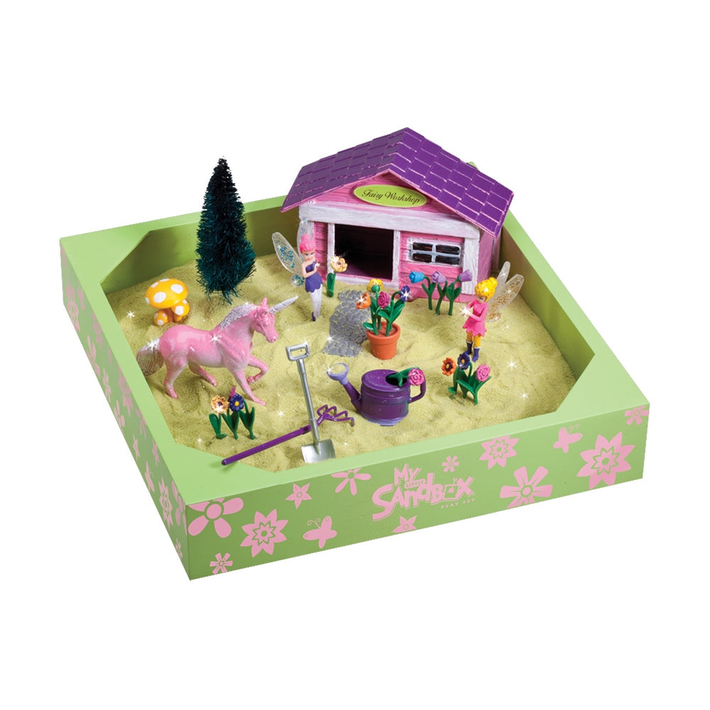 My Little Sandbox Fairy Garden playset with purple-roofed cottage, pink horse, miniature figures, flowers, tree, watering can, and sandbox base with flower-patt