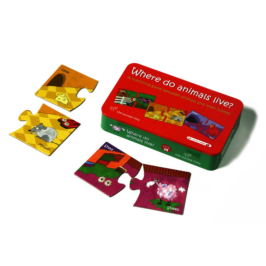 Where Do Animals Live puzzle set with red box and three colorful puzzle pieces showing animals including a hole, mouse, and sheep