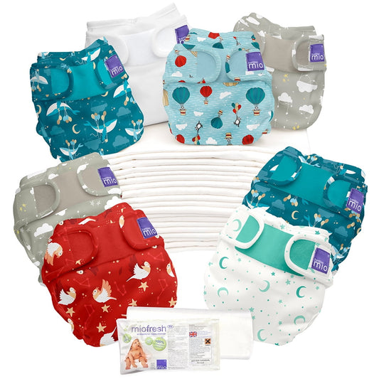 Bambino Mio reusable diaper set with six patterned cloth diapers in teal, light blue, gray, red, and cream with moon and star designs, plus white diaper inserts