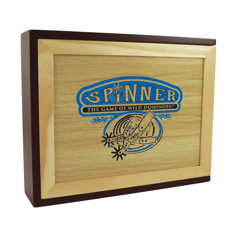 Wooden box with light and dark wood frame containing Spinner Wild Dominoes game, featuring blue and gold logo and domino illustration on lid