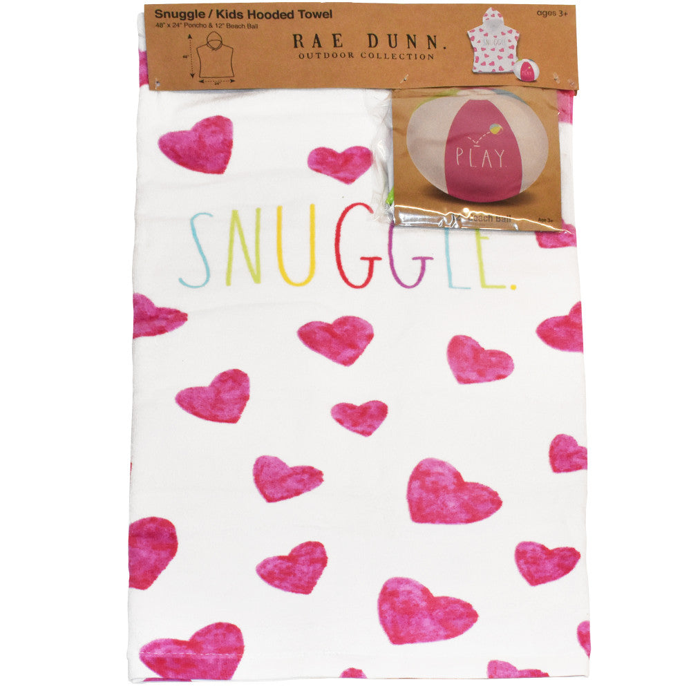 Rae Dunn Snuggle Kids Hooded Towel with white cotton terry fabric printed with pink hearts and colorful text, shown with coordinating pink and cream beach ball