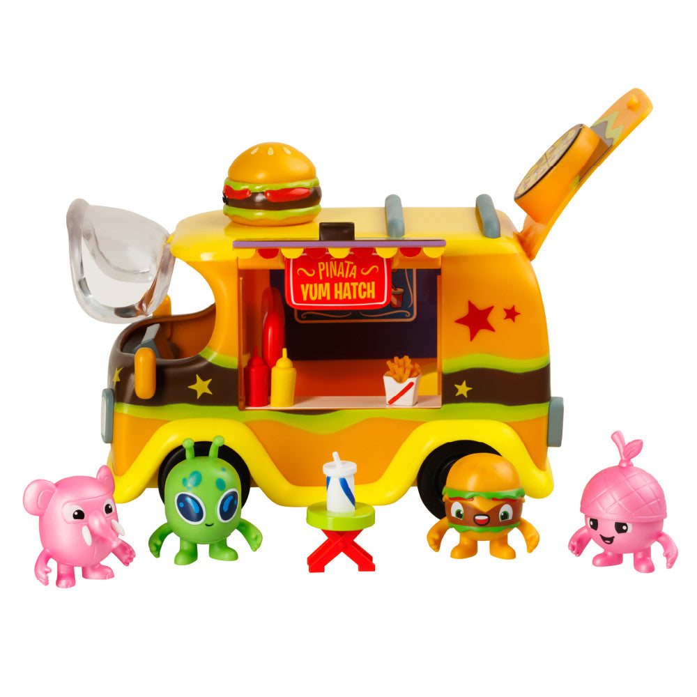 Pinata Yum Hatch food truck playset with colorful character figures including pink elephant, green alien, orange character, and accessories on plain background