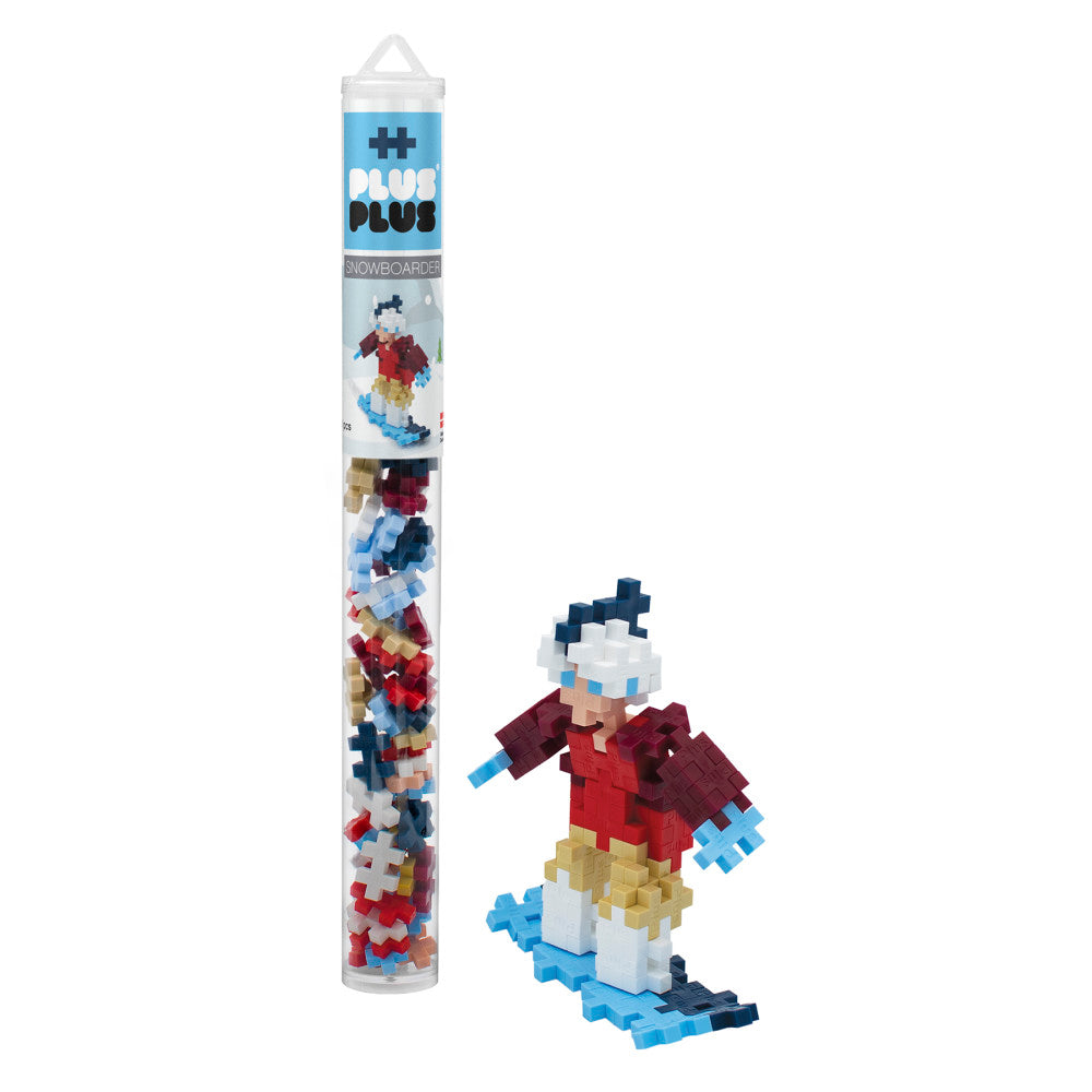 Plus-Plus Mini building blocks snowboarder set with cylindrical tube packaging and assembled pixel-art snowboarder figure in red jacket and blue snowboard