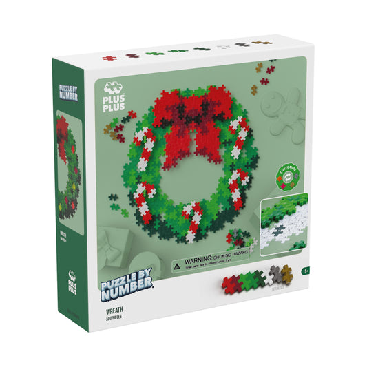 Plus-Plus Wreath Puzzle By Number box showing completed 500-piece red, green, and white wreath puzzle with interlocking plastic pieces