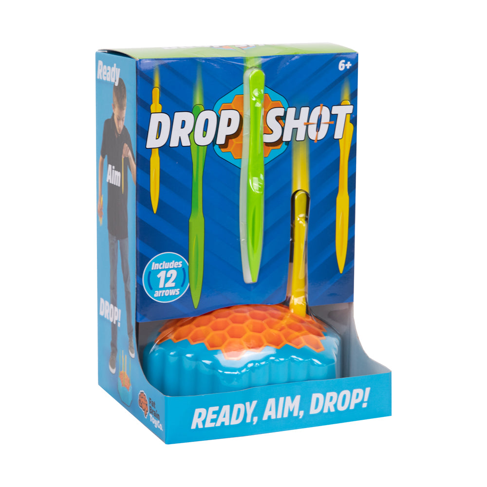 Drop Shot game box showing blue base with orange and teal honeycomb target, yellow and green foam arrows, and "Ready, Aim, Drop!" tagline; includes 12 arrows