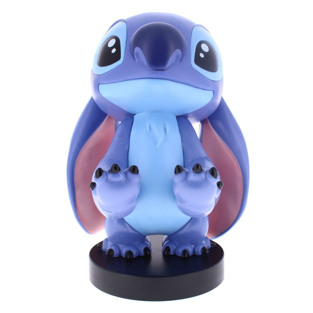 Blue and purple plush Stitch character figure with large eyes, wide smile, and pink inner ears, mounted on a black base