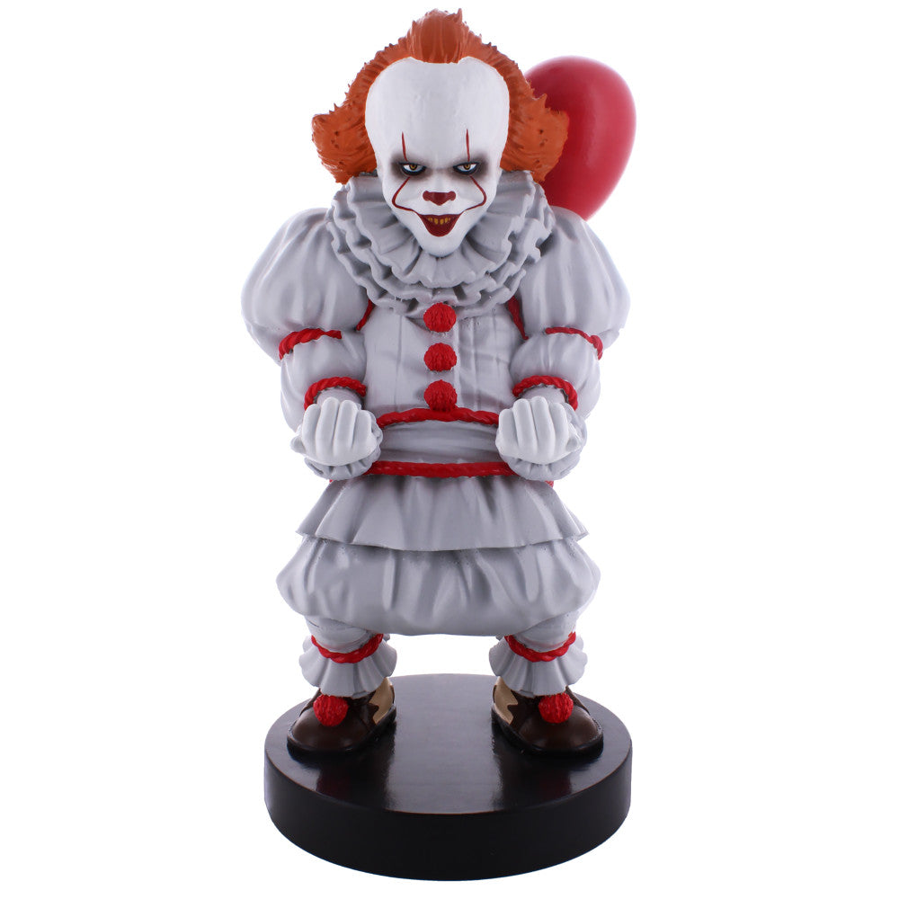 Pennywise clown figure with white and red costume, orange hair, holding a red balloon, mounted on black base