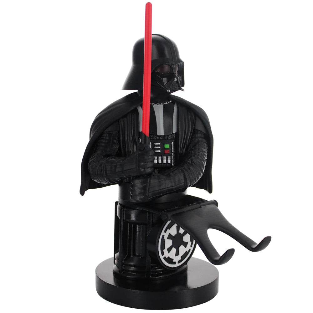 Darth Vader figure in black outfit holding red lightsaber, seated on cylindrical base with Empire logo, functions as phone stand and controller holder