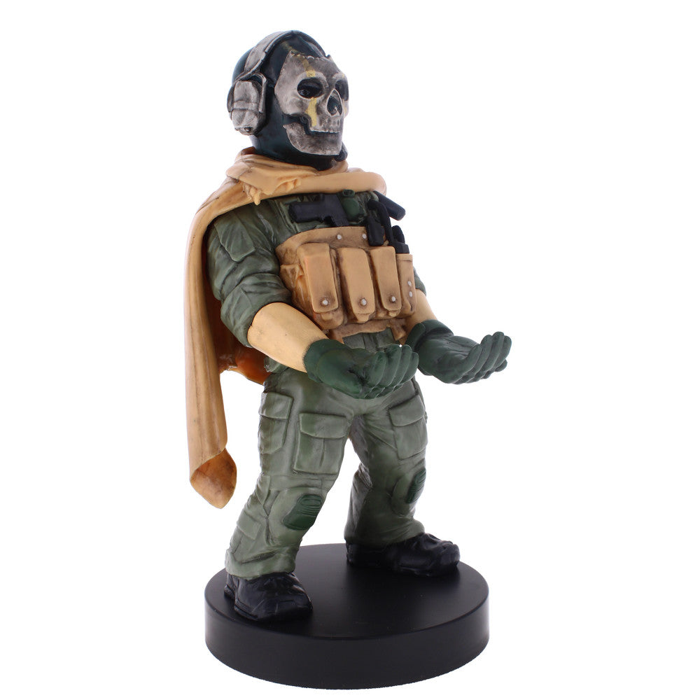 Call of Duty Warzone Ghost action figure with skull mask, tan cape, green tactical suit, and ammo vest, mounted on black base