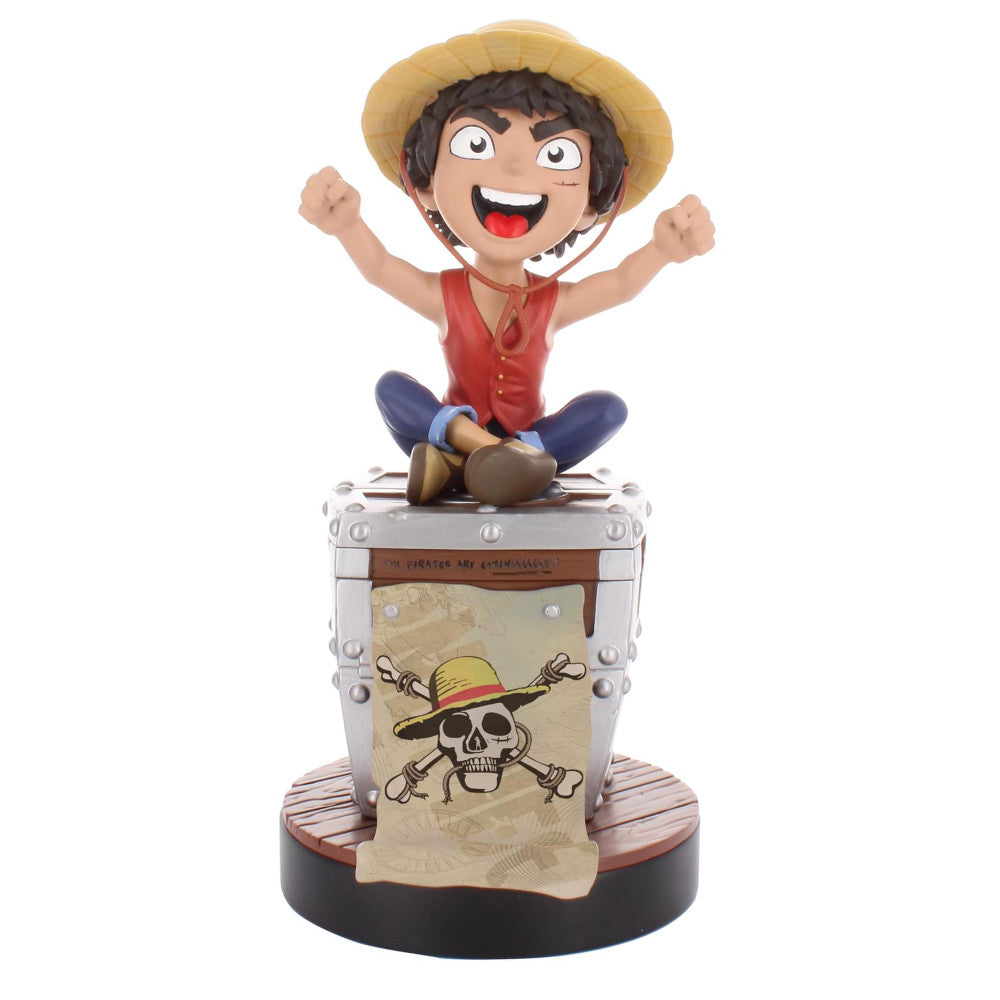Luffy collectible figure with straw hat sitting on treasure chest base, arms raised, wearing red shirt and blue pants
