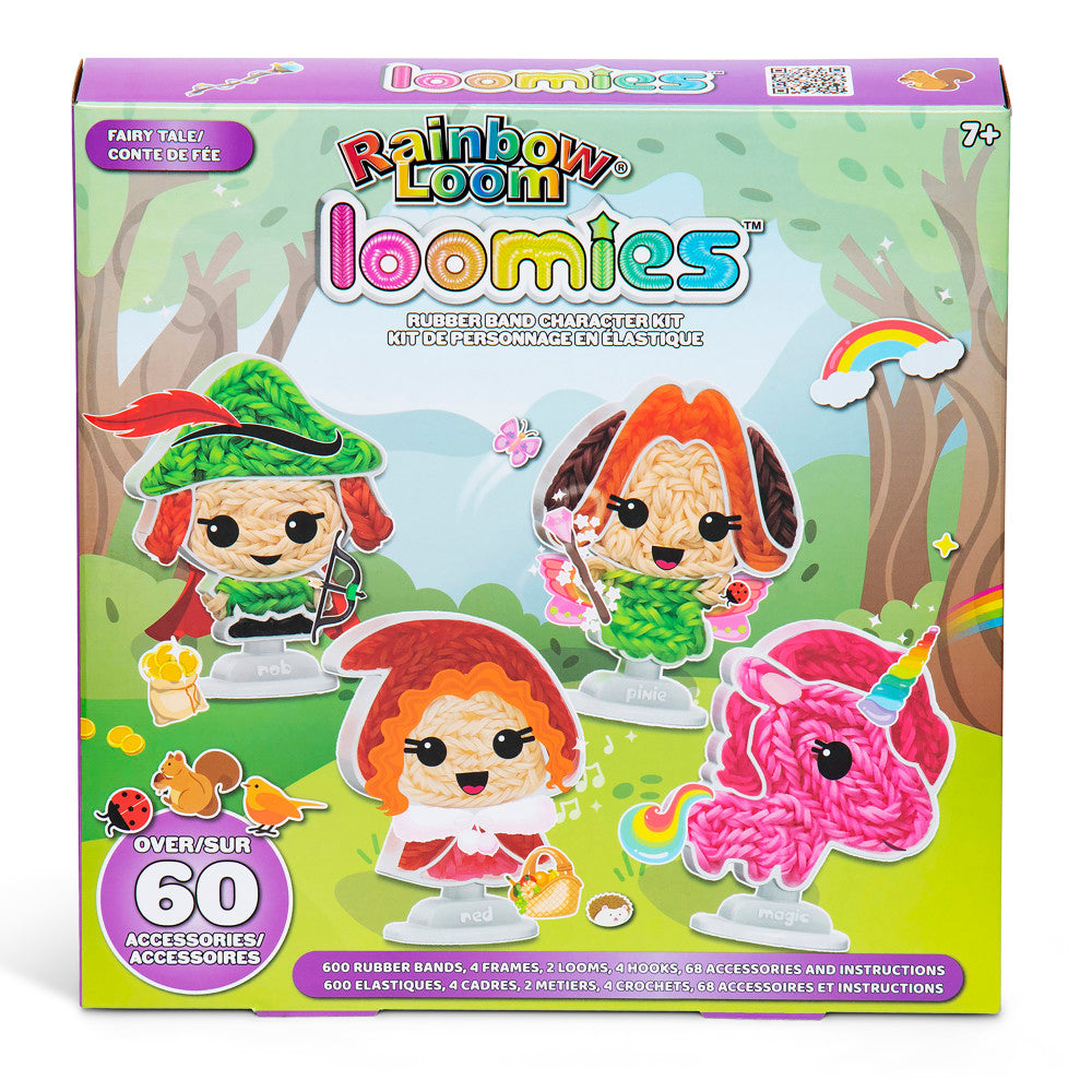 Rainbow Loom Loomies Fairy Tale rubber band character kit with four colorful loom figures featuring red, orange, and pink hair, displayed on grass with trees an
