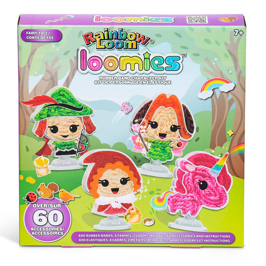 Rainbow Loom Loomies Fairy Tale rubber band character kit with four colorful loom figures featuring red, orange, and pink hair, displayed on grass with trees an
