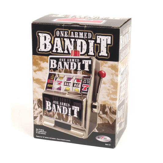 One Armed Bandit miniature slot machine bank with red lever, displayed in packaging showing Western landscape background