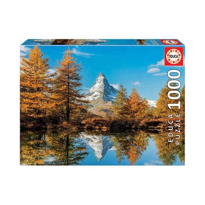 Educa 1000-piece jigsaw puzzle box featuring Matterhorn mountain reflected in autumn lake with golden larch trees