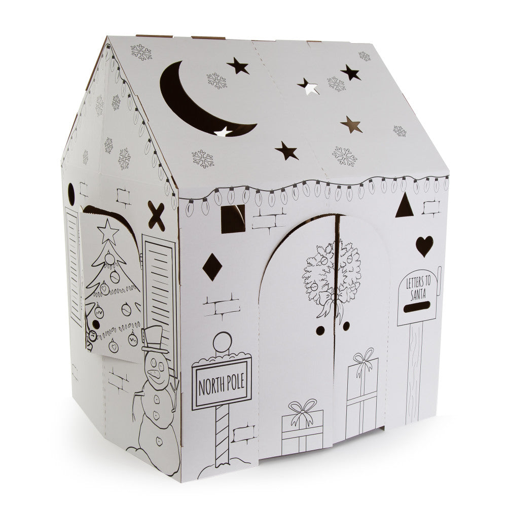 White cardboard playhouse with black line drawings of Christmas scenes including snowman, North Pole sign, presents, tree, moon and stars on roof, and letters t