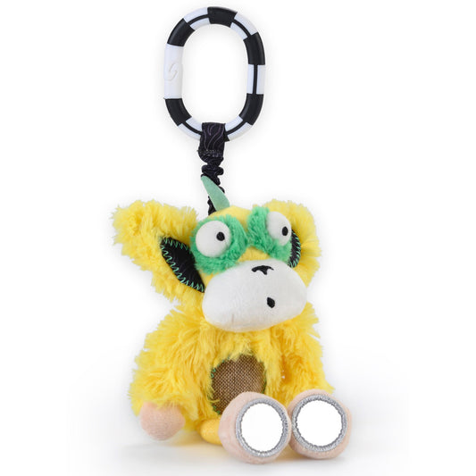 Yellow fuzzy plush toy with green face, bulging eyes, and horns, attached to black and white segmented hanging ring with textured belly patch and reflective fee