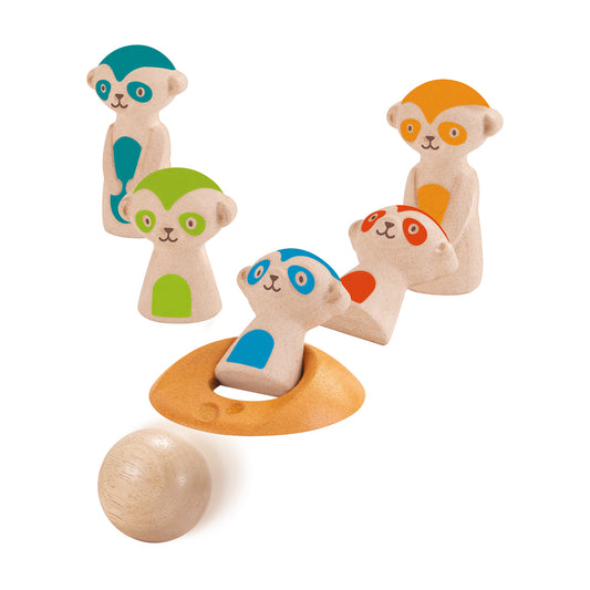 Four wooden meerkat bowling pins in cream with teal, green, orange, and red accents, plus wooden bowling ball and orange base ring