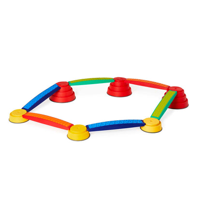 Colorful sensory integration toy with yellow cup feet, red and green cone connectors, and multicolored arched bridges in blue, yellow, orange, and green arrange