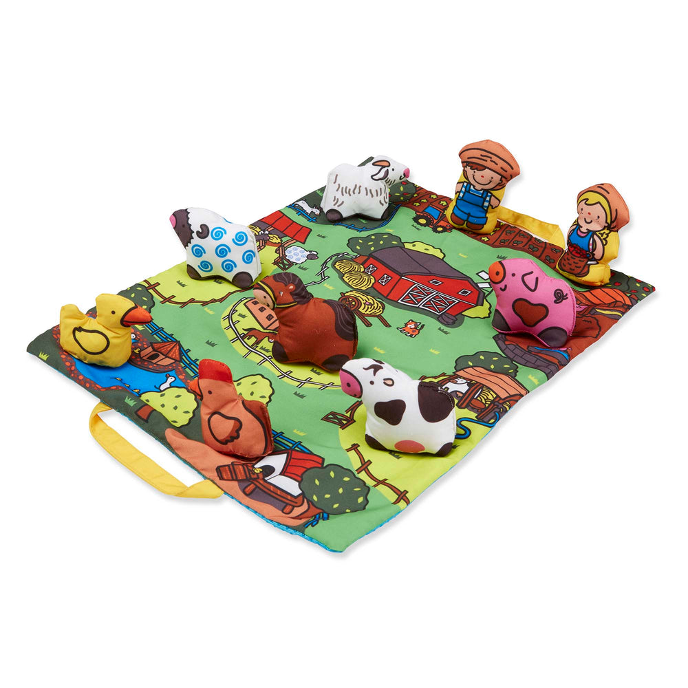 Farm-themed play mat with attached plush animals including cow, sheep, and pig; two child figurines; colorful fabric mat with barn and farm scene illustrations