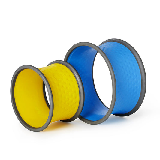 Two yellow and two blue cylindrical body wheels with gray rims, stacked and arranged for display on a plain white background