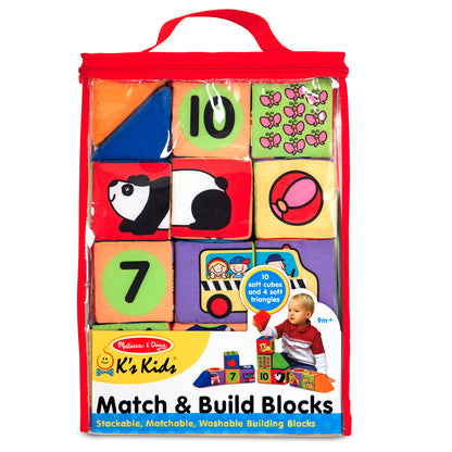 Melissa & Doug Match & Build Blocks soft cube set with colorful patterned blocks showing numbers, shapes, and animals, displayed in red fabric carrying case