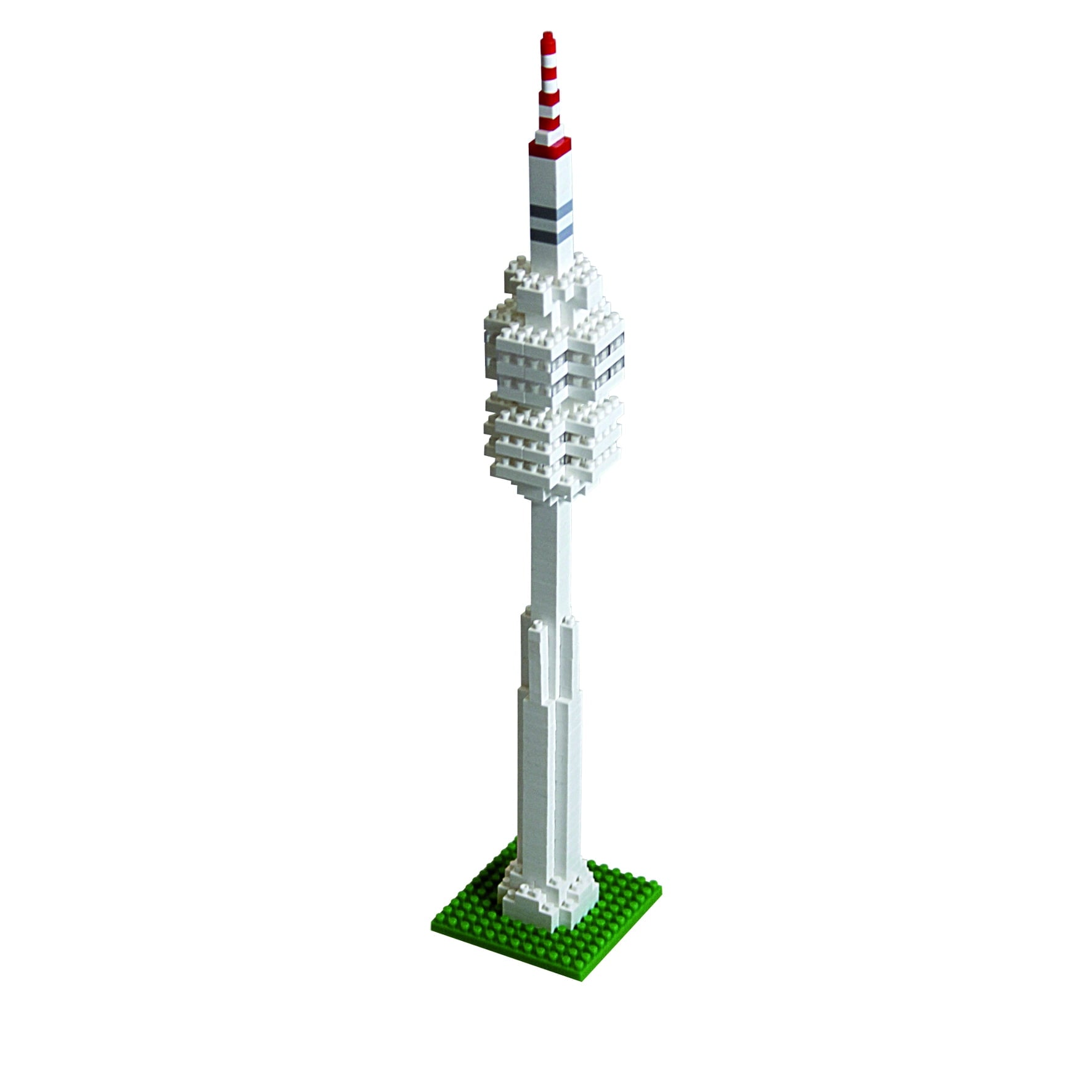 Brixies building kit model of Olympic Tower with white brick structure, red and white striped antenna top, and green baseplate