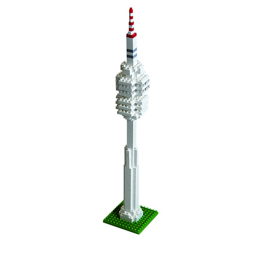 Brixies building kit model of Olympic Tower with white brick structure, red and white striped antenna top, and green baseplate