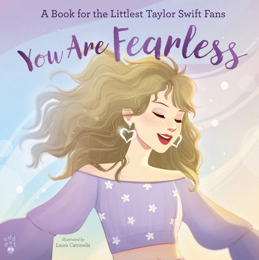 A Book for the Littlest Taylor Swift Fans You Are Fearless illustrated by Laura Catrinella book cover featuring an illustrated blonde woman with long wavy hair