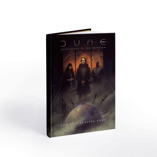 Dune: Adventures in the Imperium RPG Core Rulebook, hardcover game book with dark cover featuring three robed figures and a glowing planet