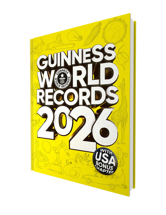 Guinness World Records 2026 hardcover book with bright yellow cover featuring illustrated icons and white text, with USA bonus chapter badge