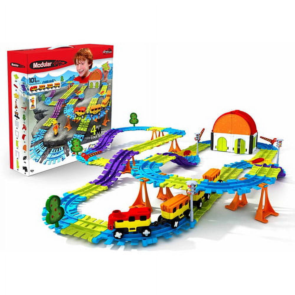 Modular Toys 3D Express Kit with colorful interlocking track pieces in blue, yellow, and purple, plastic train cars, depot building with orange dome roof, trees