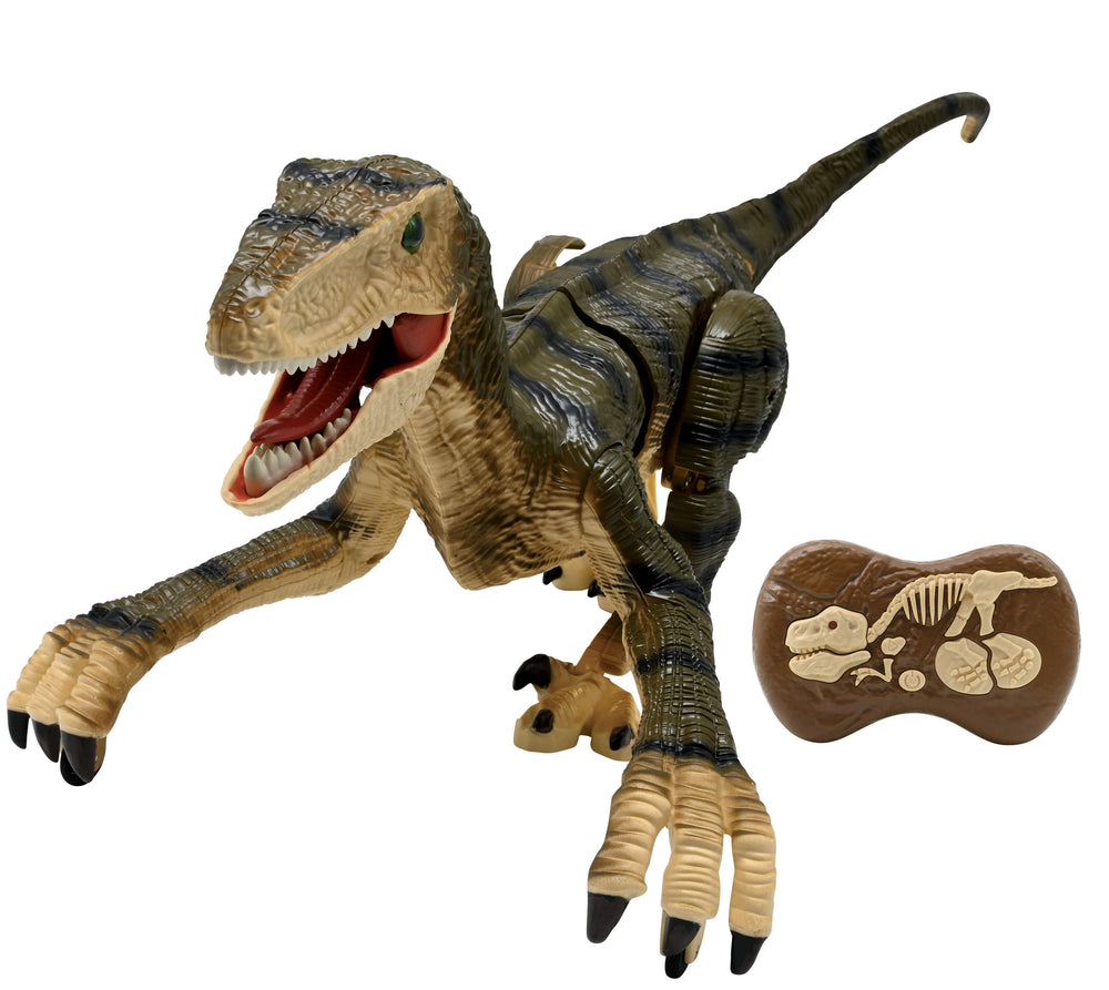 Tan and black remote control velociraptor dinosaur with open mouth showing red interior, articulated limbs, and tail, shown with brown controller featuring dino