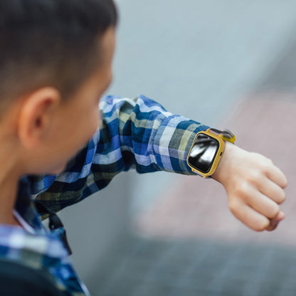 Batman Camera Digital Watch with yellow case worn by child, blue plaid shirt