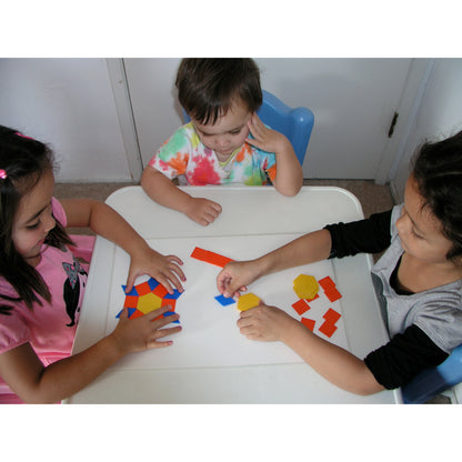 EduStic Pattern Smart Game with colorful geometric shapes in red, blue, and yellow being arranged by children