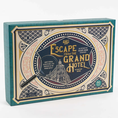 Escape from the Grand Hotel Mystery Puzzle Game box with teal spine, ornate vintage frame design, magnifying glass graphic, and gold lettering on cream and navy