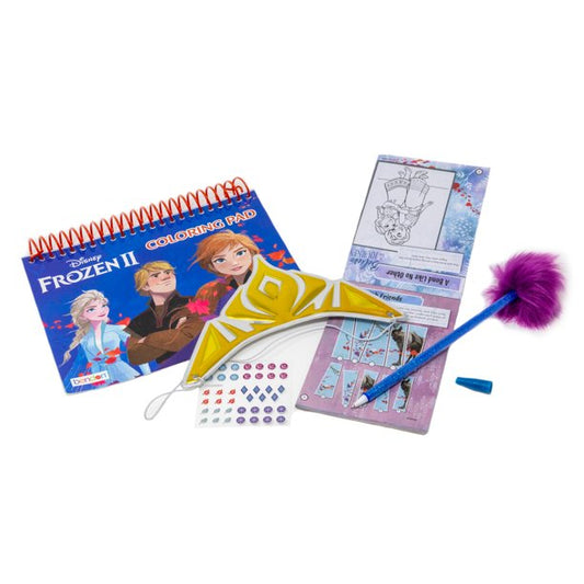 Disney Frozen 2 Art Creativity Suitcase contents displayed: spiral-bound coloring pad featuring Anna, Elsa, and Kristoff; yellow crown craft; purple and blue fe