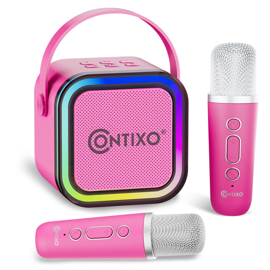Pink Contixo karaoke machine with LED-lit speaker, carrying handle, and two wireless microphones with mesh heads