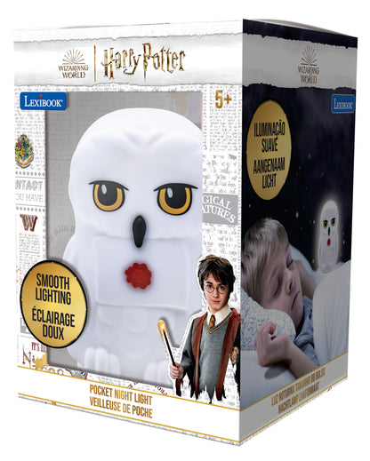 Harry Potter Hedwig owl pocket night light with smooth soft white lighting, modeled by a child wearing glasses and Hogwarts robes