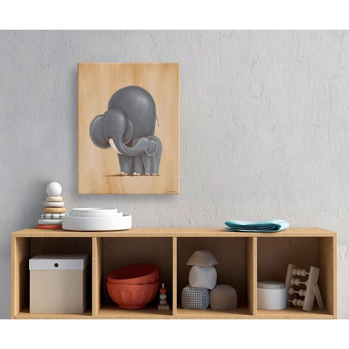 Adult elephant nuzzling baby elephant illustration on light wood canvas, hung above wooden storage shelving