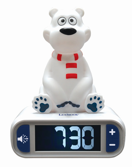 White polar bear character sitting on top of Lexibook digital alarm clock displaying 7:30, with red chest buttons and blue paw pads