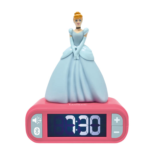 Cinderella doll in light blue ball gown on top of pink digital alarm clock displaying 7:30, with speaker and Bluetooth icons