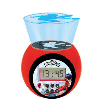 Red Miraculous Ladybug projector alarm clock with blue sky projection on dome top, digital display showing time, character graphics on front, and control button