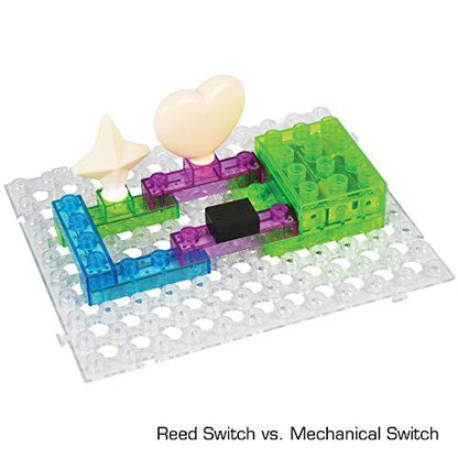 Circuit Blox 72 building block set with translucent colored blocks, gears, and cream-colored connectors on clear pegboard base