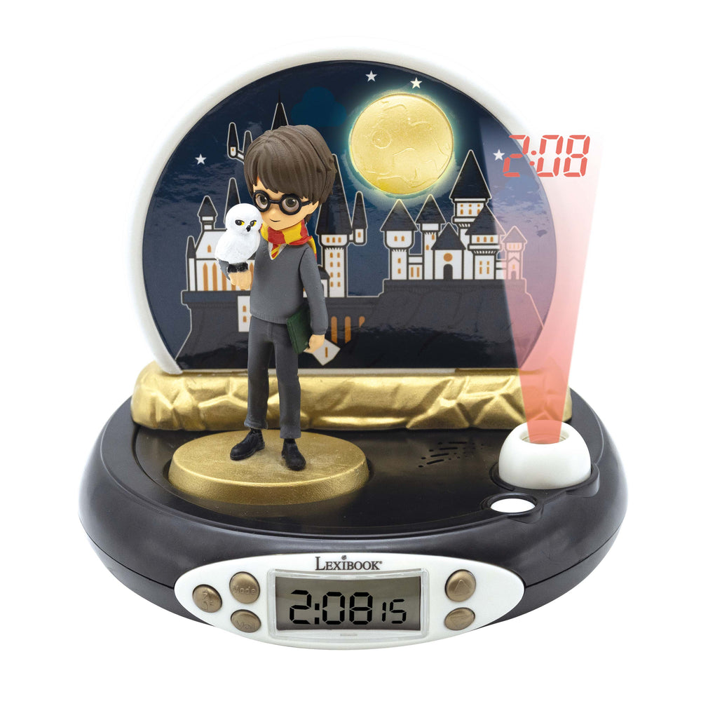 Lexibook Harry Potter 3D projector alarm clock with wizard character figurine holding owl, illuminated castle backdrop, moon, and digital display showing time