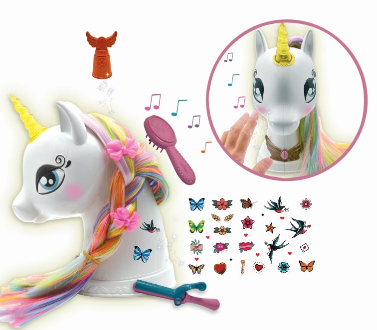 White unicorn styling head with rainbow mane and yellow horn, includes brush, hair clips, and decorative sticker sheet; interactive features shown in circular i