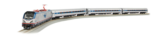 Bachmann Trains Amtrak City Sprinter HO scale electric train set with locomotive and three passenger cars on curved track, displayed against plain background