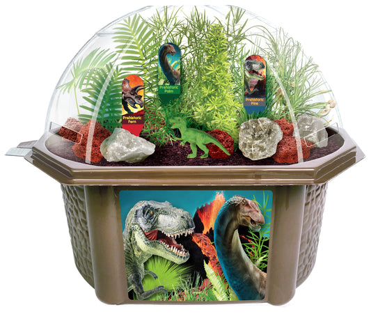 Dinosaur Domain Biosphere Terrarium Kit with clear dome top containing live plants, rocks, sand, and labeled dinosaur figurines including fern, palm, and pine s